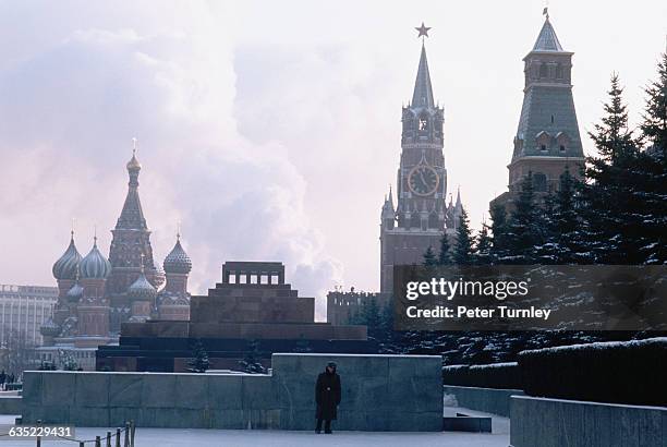 Guard monitors a walkway to Lenin's Tomb in Moscow's Red Square in winter.