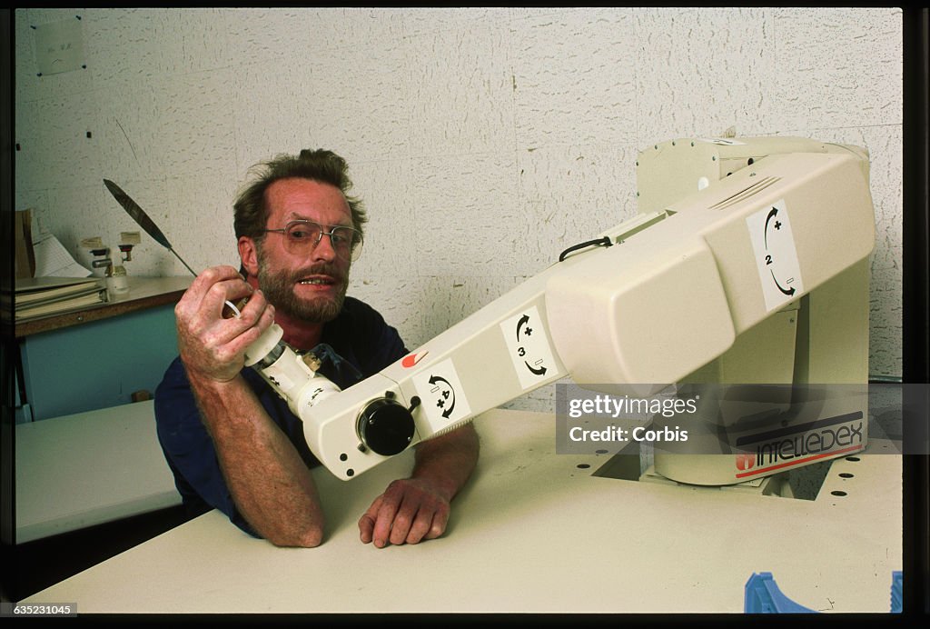 Scientist Arm Wrestling Robotic Arm
