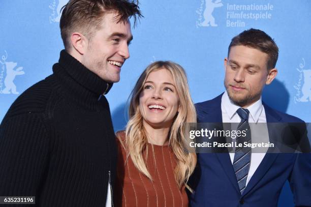 Actor Robert Pattinson, actress Sienna Miller and actor Charlie Hunnam attend the 'The Lost City of Z' photo call during the 67th Berlinale...