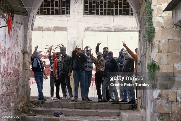 Masked Palestinian Guerrillas Giving Hand Signs