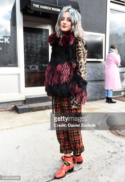 Model Chloe Norgaard is seen wearing an animal print fur coat with plaid pants outside of the 3.1 Phillip Lim show during New York Fashion Week:...