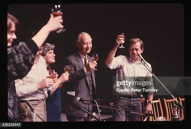 Alexander Dubcek and Vaclav Havel are joined by other Czechoslovakian politicians as they toast the resignation of the Communist politburo in...