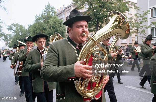 Brass band marches to the Oktoberfest grounds during the morning procession.