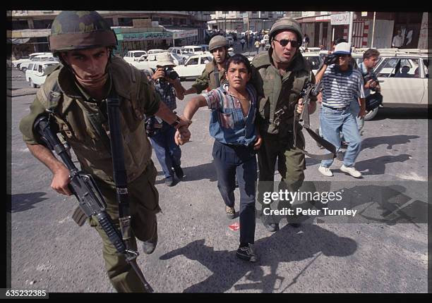 Palestinians and Israelis clash on the streets of Hebron on the day of the signing of an accord granting the city self-rule. One of the oldest cities...