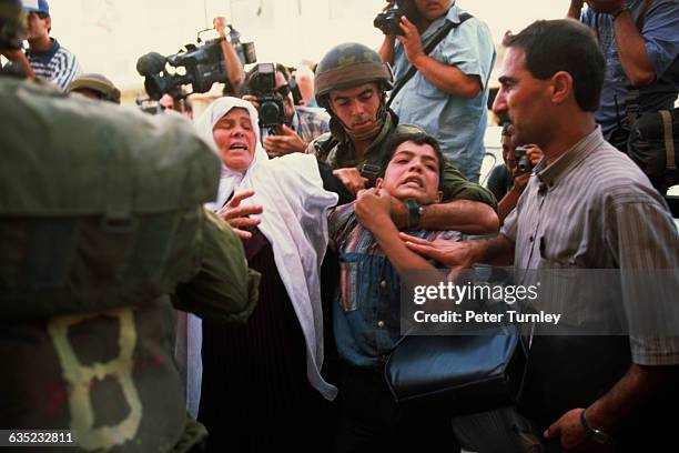 Palestinians and Israelis clash on the streets of Hebron on the day of the signing of an accord granting the city self-rule. One of the oldest cities...