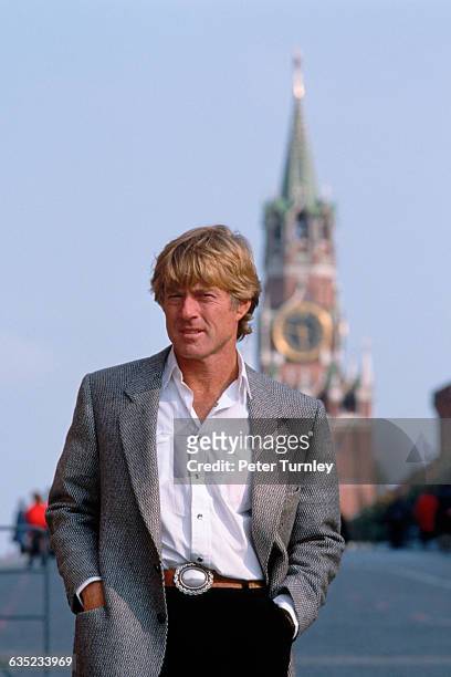American actor/motion picture director Robert Redford stands in Red Square with a spire of the Kremlin in the background. His films include Butch...