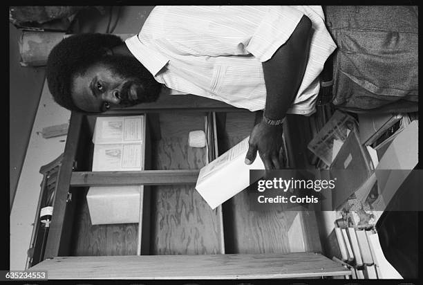 Jim Cobb holds a box containing the ashes of a loved one who died in the Jonestown massacre in Guyana. Cobb has kept the ashes of his three sisters...