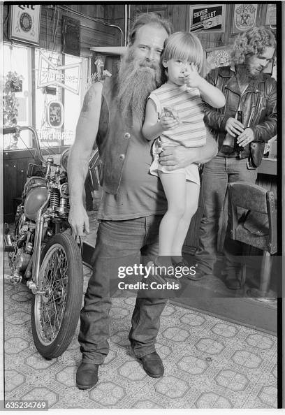 Roger Cunningham Biker Roger Cunningham holds his son J.R. His friend Terry Blaine ...