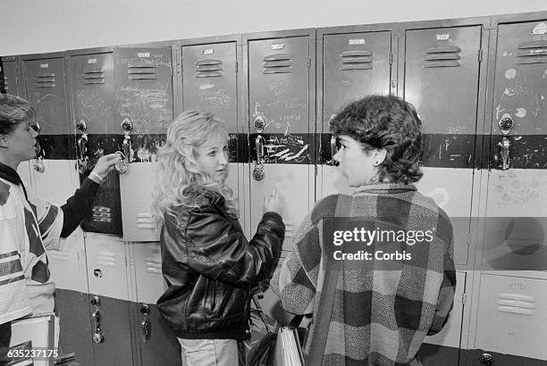Amie Marshall talks with her friend Maja Pakenham at her locker. Both are teenagers recovering from drug abuse.