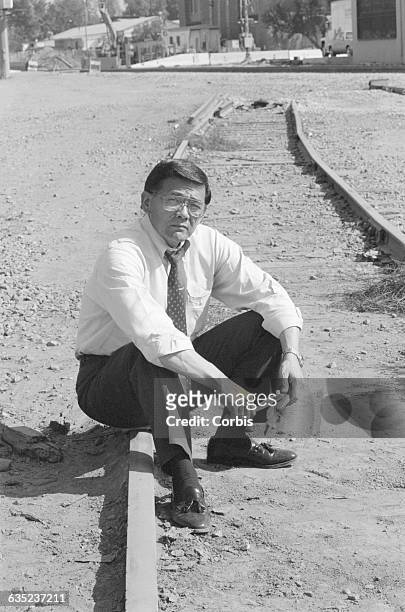 Congressman Norman Mineta sits on the spot at which, in 1942, he had to abandon his home and board a train which took him to the Santa Anita Assembly...