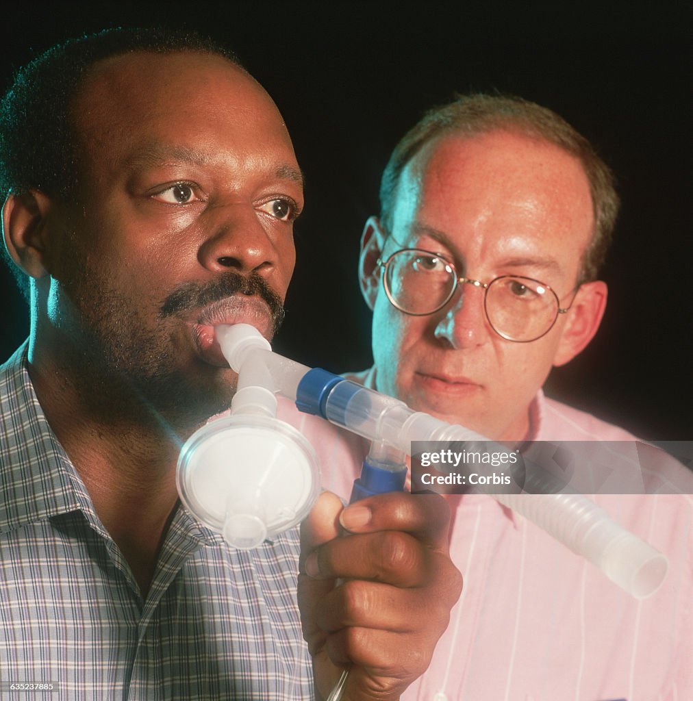 AIDS Patient Inhaling a Preventative Medicine