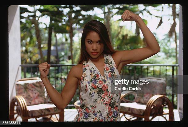 Keahe Lindsey flexes as she stands in the lobby of the Royal Waikoloan Hotel on the island of Hawaii.