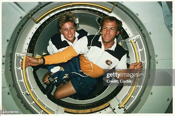 Jan Davis and Mark Lee, the first married couple in space, aboard the shuttle Endeavor.