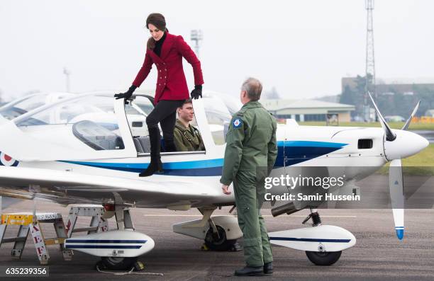 Catherine, Duchess of Cambridge climbes out of a plane during a visit to the RAF Air Cadets at RAF Wittering on February 14, 2017 in Stamford,...