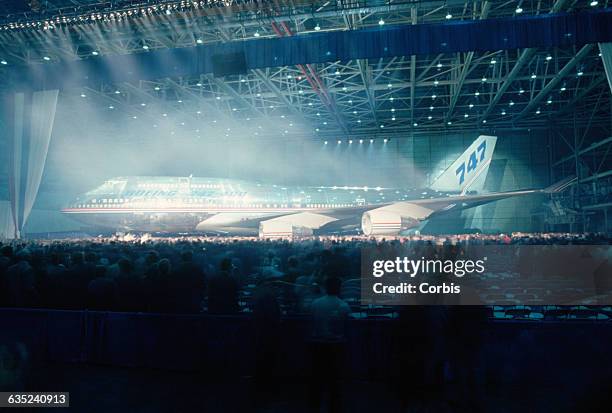 Boeing unveils the world's largest and longest-range jetliner. Carries 412 people for 8100 miles.