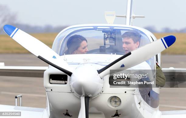 Catherine, Duchess of Cambridge is seen inspecting a training plane during a visit to the RAF Air Cadets at RAF Wittering on February 14, 2017 in...
