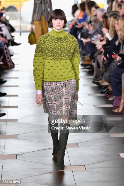 Model walks the runway at the Tory Burch FW17 Show during New York Fashion Week at the Whitney Museum of American Art on February 14, 2017 in New...