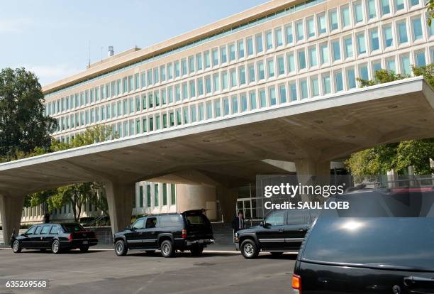 Vehicles in US President George W. Bush's motorcade waits outside CIA Headquarters in Langley, Virginia, on August 14 as Bush meets with CIA Director...