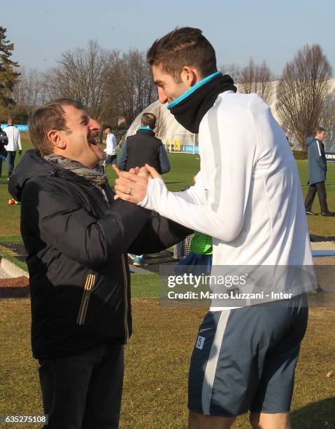 Giacomo Poretti shakes hands with Roberto Gagliardini during the FC Internazionale training session at the club's training ground Suning Training...