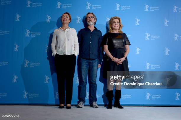 Actress Catherine Frot, director Martin Provost and actress Catherine Deneuve attend the 'The Midwife' photo call during the 67th Berlinale...