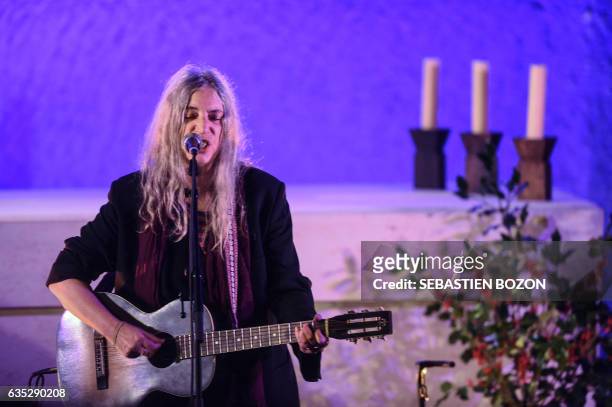 Singer Patti Smith performs on stage during the Generiq music festival on February 14 at the Ronchamp chapel designed by French architect Le...