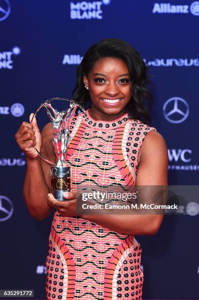 Winner of the Laureus World Sportswoman of the Year Award Gymnast Simone Biles of the US poses with her trophy the Winners Press Conference and...