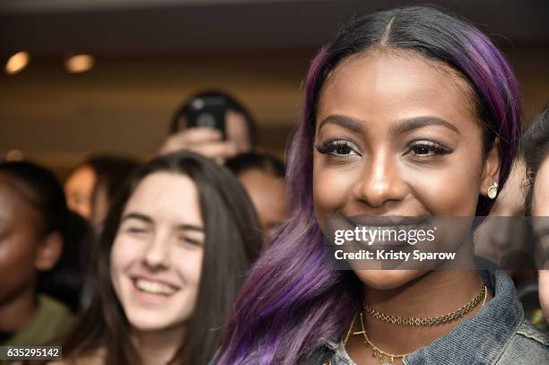 Justine Skye poses with fans during the Boy Meets Girl x Care Bears Collection at Colette on February 14, 2017 in Paris, France.