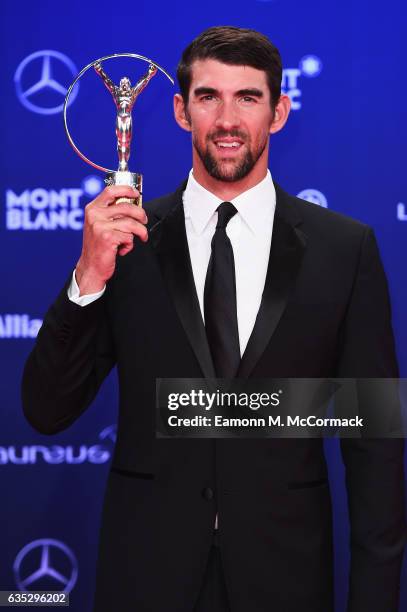 Winner of the Laureus World Comeback of the Year Swimmer Michael Phelps of the US poses with his trophy at the Winners Press Conference and Photocall...