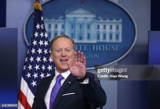 White House Press Secretary Sean Spicer waves as he leaves after a daily press briefing at the James Brady Press Briefing Room February 14, 2017 at...