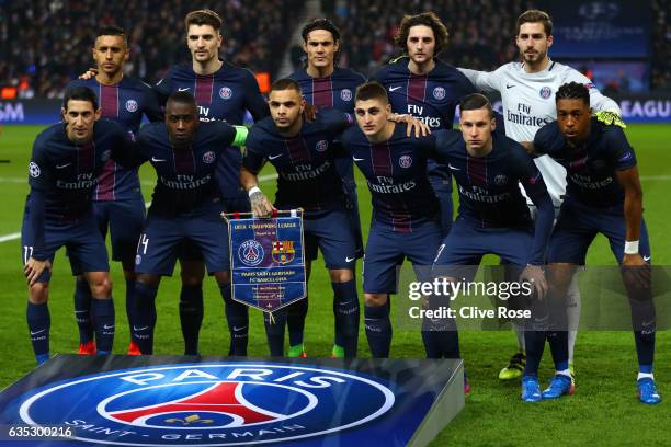 The Paris Saint-Germain players line up for a team photograph before the UEFA Champions League Round of 16 first leg match between Paris...