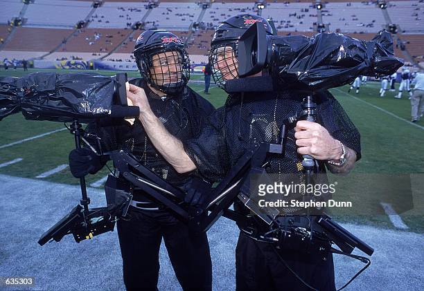 General view of a Steadi-Cam operator helping clean a lense before the game between the Los Angeles Xtreme and the Chicago Enforcers at the L.A....