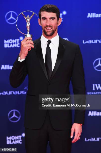 Winner of the Laureus World Comeback of the Year Swimmer Michael Phelps of the US poses with his trophy at the Winners Press Conference and Photocall...