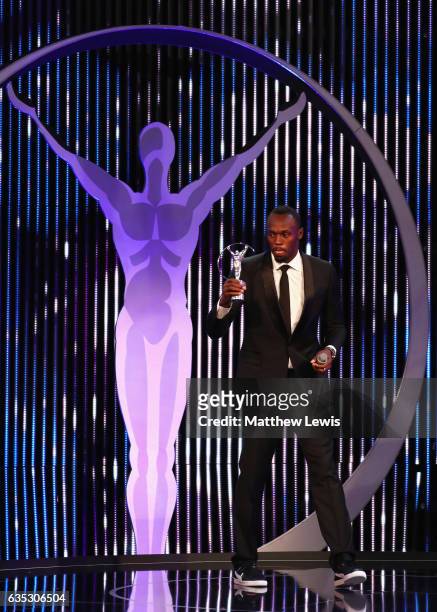 Athlete Usain Bolt of Jamaica with his Laureus World Sportsman of the Year Award on stage during the 2017 Laureus World Sports Awards at the Salle...
