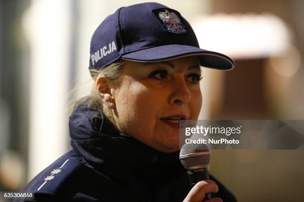 Karolina Poziomka of the local police force is seen speaking to women attending the 1 billion rising event on 14 February in Bydgoszcz, Poland. The...