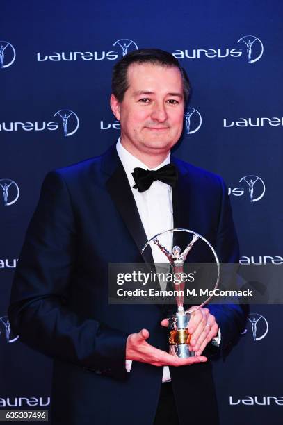 Chairman and owner of the Chicago Cubs Tom Ricketts poses with the Laureus World Team of the Year Award accepted on behalf of the team at uring the...