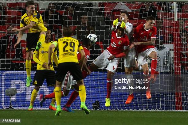 Benfica's Brazilian goalkeeper Ederson Moraes saves the ball during the Champions League football match between SL Benfica and Borussia Dortmund at...