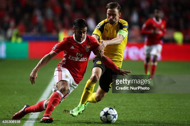 Benfica's Argentinian midfielder Eduardo Salvio vies with Dortmund's defender Sokratis Papastathopoulos during the Champions League football match...