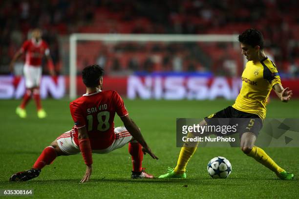 Dortmund's defender Bartra vies with Benfica's Argentinian midfielder Eduardo Salvio during the Champions League football match between SL Benfica...
