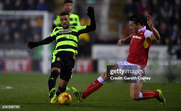 Elias Kachunga of Huddersfield is tackled by Stephen Kelly of Rotherham during the Sky Bet Championship match between Rotherham United and...