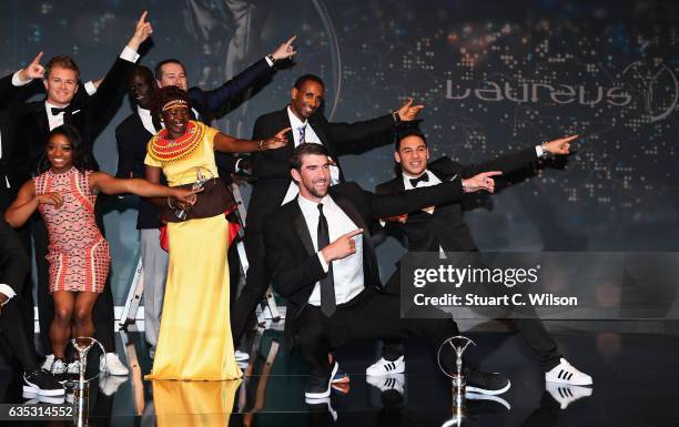 Swimmer Michael Phelps of the US, winner of the Laureus World Comeback of the Year poses on stage with other winners during the 2017 Laureus World...