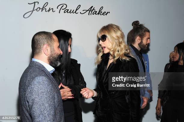 Designer Numan Ataker and a guest attend the John Paul Ataker Fall Winter 2017 Runway Show at Pier 59 on February 14, 2017 in New York City.