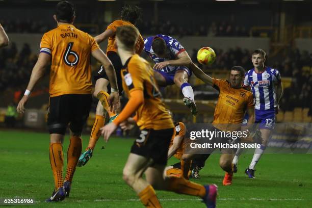 Jake Buxton of Wigan scores his sides opening goal during the Sky Bet Championship match between Wolverhampton Wanderers and Wigan Athletic at...