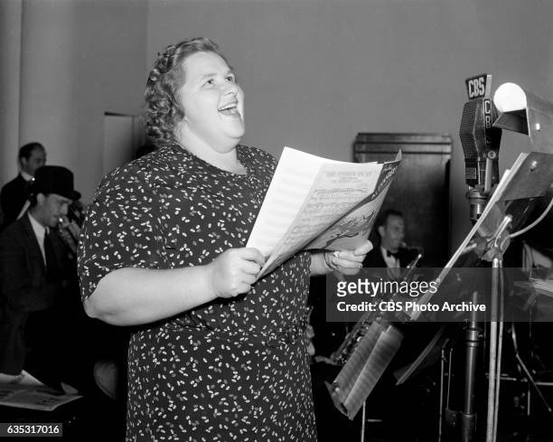 Kate Smith rehearses for CBS Radio's "The Kate Smith Hour" New York, NY. Image dated September 29, 1938.