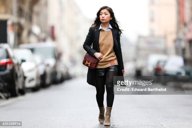 May Berthelot, Head of Legal at Videdression.com and fashion blogger, wears Zara camel suede boots, a The Kooples black leather short, a Topshop...