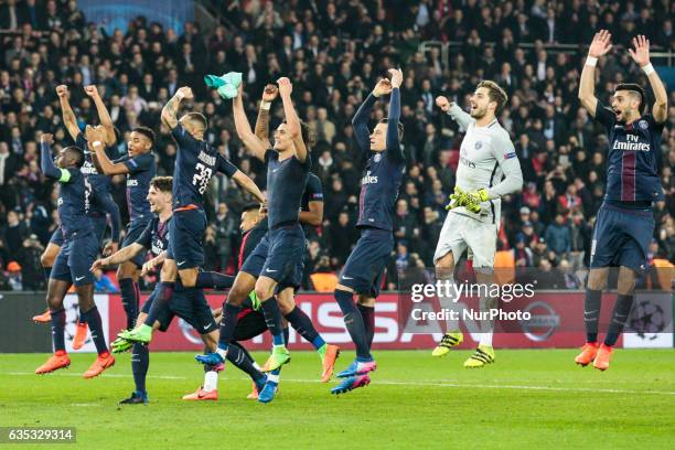 Teammates celebrate at the end of the UEFA Champions League round of 16 first leg football match between Paris Saint-Germain and FC Barcelona on...