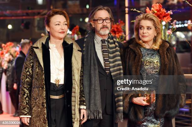 Actress Catherine Frot, Director Martin Provost And Actress Catherine Deneuve attend the 'The Midwife' premiere during the 67th Berlinale...