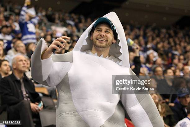 San Jose Sharks fan wears a shark costume at an NHL game against the Toronto Maple Leafs during the third period at the Air Canada Centre on December...