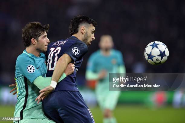 Sergi Roberto of FC Barcelona and Javier Pastore of Paris-Saint Germain fight for the ball during the UEFA Champions League Round of 16 first leg...