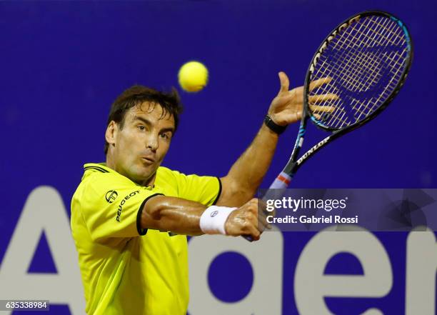 Tommy Robredo of Spain takes a backhand shot during a first round match between Tommy Robredo of Spain and Fabio Fognini of Italy as part of ATP...