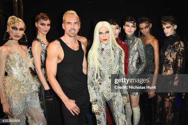 Designer David Blond and Phillipe Blond pose with models backstage for the The Blonds collection during, New York Fashion Week: The Shows at Gallery...